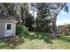 Picture of the backyard featuring mature trees, lush landscaping, and a storage shed at 1481 Glastonberry Rd, Maitland, FL 32751