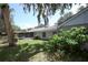 Picture of the backyard featuring mature trees, lush landscaping, and a screened-in patio at 1481 Glastonberry Rd, Maitland, FL 32751