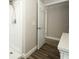 Bathroom view showing the white shower, flooring, and a glimpse into the hallway at 1481 Glastonberry Rd, Maitland, FL 32751