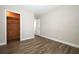 Bedroom with wood-style laminate floors featuring a cedar closet at 1481 Glastonberry Rd, Maitland, FL 32751