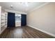 Bedroom featuring wood floors, built-in shelves, and ample natural light at 1481 Glastonberry Rd, Maitland, FL 32751