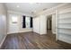 Bright bedroom with hardwood floors, large window, closet, and neutral paint at 1481 Glastonberry Rd, Maitland, FL 32751