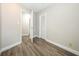 Bedroom with wood-style laminate flooring and neutral paint, showing closet at 1481 Glastonberry Rd, Maitland, FL 32751