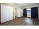 Bedroom featuring wood floors, built-in shelves, and a large closet at 1481 Glastonberry Rd, Maitland, FL 32751