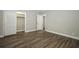 Neutral bedroom with new wood-look flooring and a closet with folding doors at 1481 Glastonberry Rd, Maitland, FL 32751