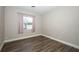 Bedroom featuring wood-style laminate flooring, natural light and pink curtains at 1481 Glastonberry Rd, Maitland, FL 32751