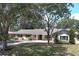 Charming single-story home with mature trees, inviting curb appeal at 1481 Glastonberry Rd, Maitland, FL 32751