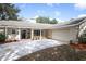 Well-maintained home featuring a spacious driveway, attached garage, and attractive landscaping at 1481 Glastonberry Rd, Maitland, FL 32751