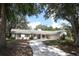 Charming ranch-style home with a landscaped front yard and a winding stone driveway at 1481 Glastonberry Rd, Maitland, FL 32751