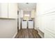 Convenient laundry room with washer, dryer, and ample storage cabinets for organization at 1481 Glastonberry Rd, Maitland, FL 32751