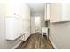 Practical laundry area with generous cabinet space, utility sink, and adjacent powder room access at 1481 Glastonberry Rd, Maitland, FL 32751