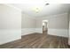 Comfortable living space featuring wood-look floors and wainscoting at 1481 Glastonberry Rd, Maitland, FL 32751