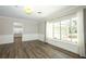Bright room featuring wood-look floors and wainscoting at 1481 Glastonberry Rd, Maitland, FL 32751