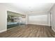Open living room featuring wood floors, ample natural light, and access to a screened patio at 1481 Glastonberry Rd, Maitland, FL 32751