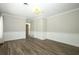 Cozy room with warm wood-look floors and neutral walls at 1481 Glastonberry Rd, Maitland, FL 32751
