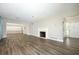 Spacious living room with fireplace, wood flooring, and plenty of natural light at 1481 Glastonberry Rd, Maitland, FL 32751