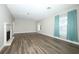 Bright living room featuring a fireplace, wood floors, and curtained windows at 1481 Glastonberry Rd, Maitland, FL 32751