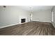 Open living room featuring a fireplace, wood floors, and recessed lighting at 1481 Glastonberry Rd, Maitland, FL 32751
