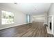 Spacious living room featuring a fireplace, wood floors, and large window at 1481 Glastonberry Rd, Maitland, FL 32751