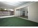 Covered screened patio with sliding door to the interior of the home at 1481 Glastonberry Rd, Maitland, FL 32751