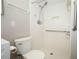 Accessible shower with handrails, built-in niche, and adjustable shower head at 1481 Glastonberry Rd, Maitland, FL 32751