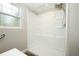 Clean bathroom with a white shower stall and light pouring through the window at 1481 Glastonberry Rd, Maitland, FL 32751