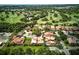 Stunning aerial view showcasing beautiful homes nestled alongside a lush, green golf course at 1769 Turnberry Ter, Orlando, FL 32804