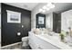 Modern bathroom with double vanity, dark accent wall and updated shower at 1769 Turnberry Ter, Orlando, FL 32804