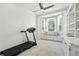 Bonus room featuring a treadmill, window bench, and storage at 1769 Turnberry Ter, Orlando, FL 32804