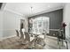 Elegant dining room with a glass table, modern chairs, and stylish chandelier at 1769 Turnberry Ter, Orlando, FL 32804