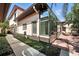 Home exterior featuring an attached sunroom and partial hardscaped backyard at 1769 Turnberry Ter, Orlando, FL 32804