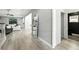 Hallway that features hardwood flooring, neutral walls, leading to the living room and bathroom at 1769 Turnberry Ter, Orlando, FL 32804