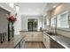 Modern kitchen with gray countertops, white cabinets, and stainless steel appliances at 1769 Turnberry Ter, Orlando, FL 32804
