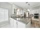 Well-lit kitchen with a center island, stainless steel appliances, and ample counter space at 1769 Turnberry Ter, Orlando, FL 32804