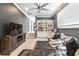Comfortable living area featuring built-in shelving and comfortable leather seating at 1769 Turnberry Ter, Orlando, FL 32804