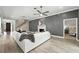 Stylish living room with hardwood floors, white sectional sofa, and a cozy fireplace at 1769 Turnberry Ter, Orlando, FL 32804