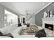 Bright living room with a white sectional sofa, fireplace, and modern decor at 1769 Turnberry Ter, Orlando, FL 32804