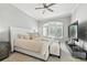 Luxurious main bedroom with a ceiling fan and bright window at 1769 Turnberry Ter, Orlando, FL 32804