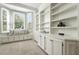 Bright office with built-in shelves and a window seat at 1769 Turnberry Ter, Orlando, FL 32804
