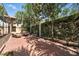 Secluded brick patio surrounded by lush landscaping, perfect for outdoor relaxation at 1769 Turnberry Ter, Orlando, FL 32804