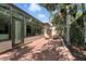 Charming brick patio with plenty of sunlight, adjacent to a wall of expansive glass windows at 1769 Turnberry Ter, Orlando, FL 32804