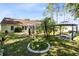 The backyard is fenced, landscaped, and features a screened-in pool and gazebo at 204 Grovepark Dr, Davenport, FL 33837