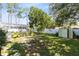 The backyard is fenced, has a storage shed, a landscaped perimeter, and an enclosed pool at 204 Grovepark Dr, Davenport, FL 33837