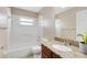 Clean bathroom with a tub, shower, and granite countertop vanity at 204 Grovepark Dr, Davenport, FL 33837