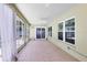 Spacious lanai with tile floors, a ceiling fan, and sliding glass doors to the backyard at 204 Grovepark Dr, Davenport, FL 33837