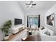 Bright living room featuring vaulted ceilings, modern decor, and large windows with backyard views at 204 Grovepark Dr, Davenport, FL 33837