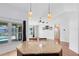 Bright, open living space with a pool view from the kitchen bar at 204 Grovepark Dr, Davenport, FL 33837