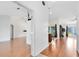 Spacious open floor plan with wood floors, light walls, and natural light at 204 Grovepark Dr, Davenport, FL 33837