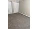 Bedroom featuring neutral walls, plush carpeting, white baseboards, and two closets at 2065 Dixie Belle Dr # O, Orlando, FL 32812