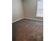 Bedroom featuring neutral walls, plush carpeting, and a window allowing natural light at 2065 Dixie Belle Dr # O, Orlando, FL 32812